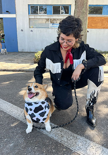 Drea dressed up with her dog