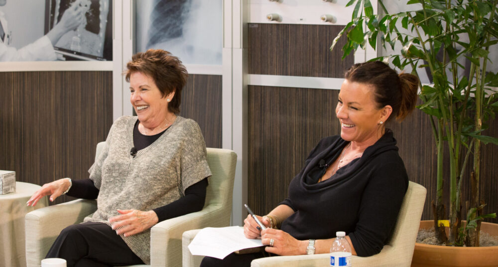 Danielle Hicks and Bonnie Addario smiling and laughing