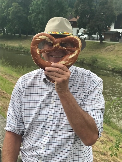 Jim holding a giant pretzel