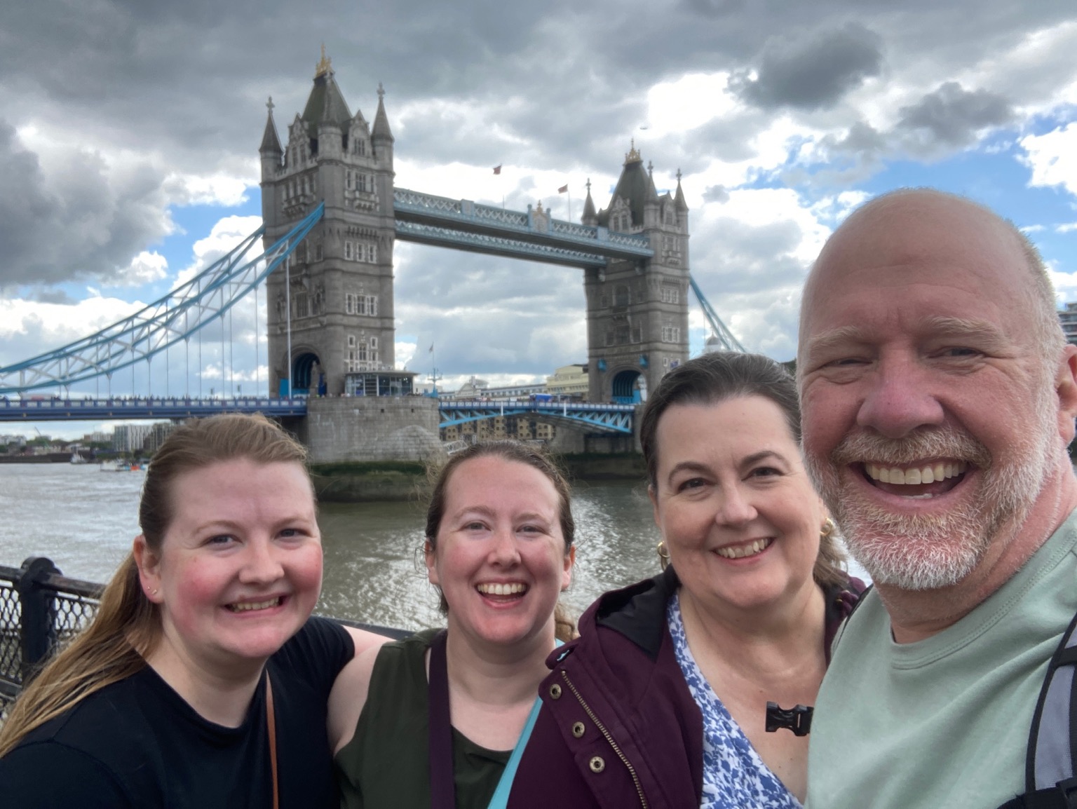 Jill and family in front of London Bridge