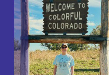 Clara in front of Colorado sign